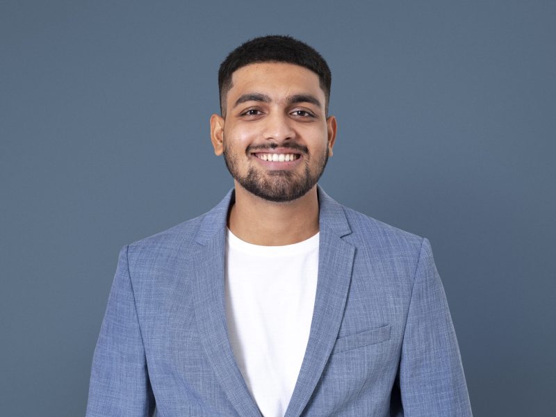 Cheerful Indian businessman smiling closeup portrait for jobs and career campaign